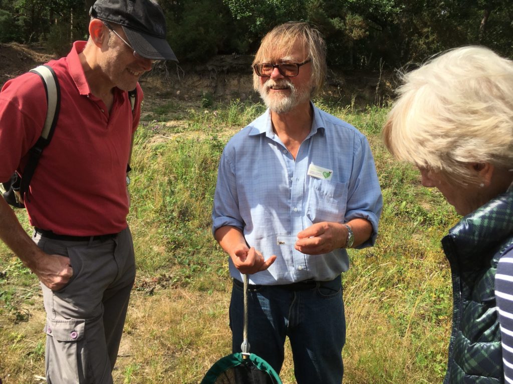 Entomologist Andrew Halstead showing insects to members of the public