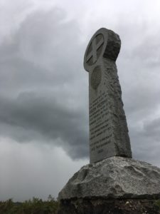 Photograph of the Victoria Monument with dark sky behind