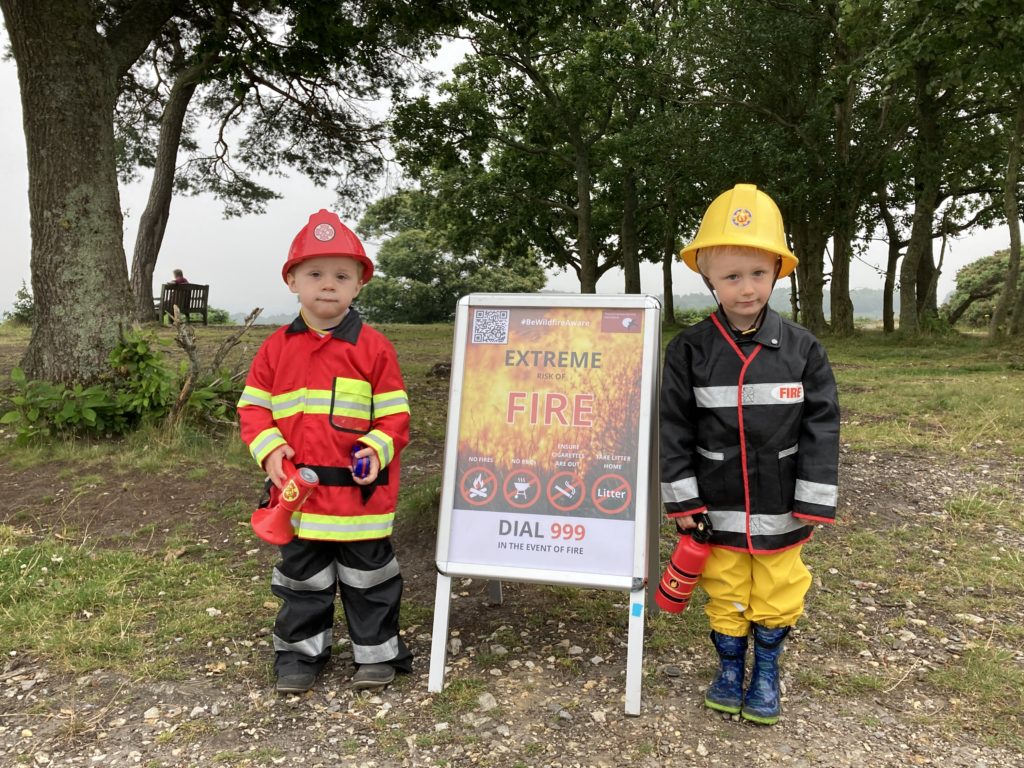 Photograph of two young boys dressed as fire fighters!