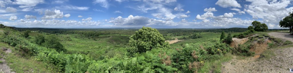 Panoramic photograph of the heathland at Caesar's Camp with distant views