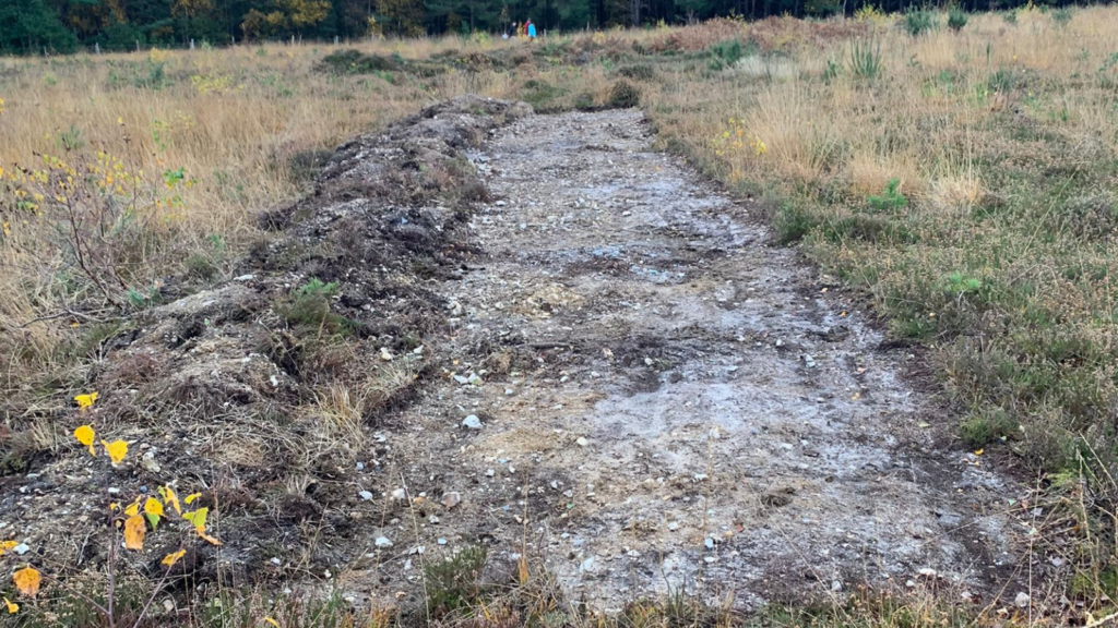 Photograph showing the vegetation has been scraped away to reveal the soil