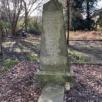 Photo of the tall memorial to the eight Airedales in the pet cemetery