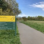 Photograph of a sign directing people to "Brooklands Heritage Area"