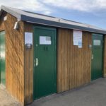 Photograph of a small toilet block