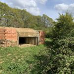 Photo of a hilltop pillbox.