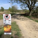 Signs asking people to keep to paths and to be aware of the fire risk