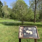 Photograph of an information sign with information about the history of Ambarrow Court (see also main text).