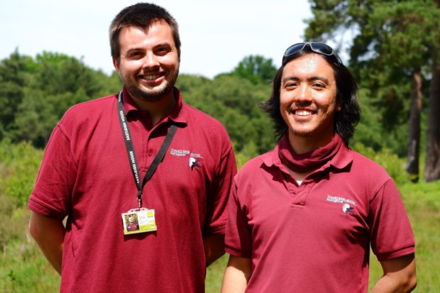 Photo of wardens Louis and Zhinlap in their burgundy uniforms.