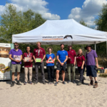 Phot of the team in front of the Amphibian and Reptile Conservation gazebo