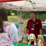 Photo of Warden Tim behind the display in the gazebo.