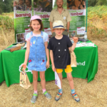 Photo of two children looking pleased about their visit to Bramshill.