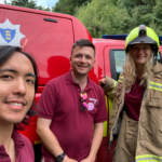 Phot of three wardens with Ruth in full fire fighting suit!