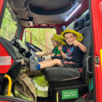 Photo of two small children in the cab.