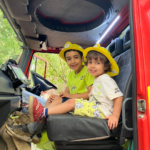 Photo of two small children in the cab.