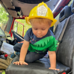 Photo of a small child in the cab.