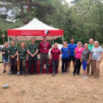 Photo of a large group of people standing in front of our gazebo.