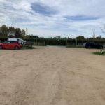 Photo of a sandy car park, with slightly sticky surface.