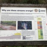 Photo of of a sign explaining about the orange streams.
