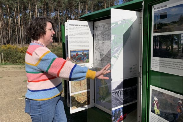 Photo of a person reading about site history in the mini museum.