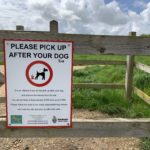 Photo of a sign asking you to "Please pick up after your dog".