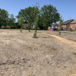 photo of the path going through an area of bare ground still being worked on