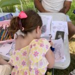 Photo of a little girl doing colouring.