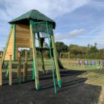 Photo of a tower for children to climb on and slide down.